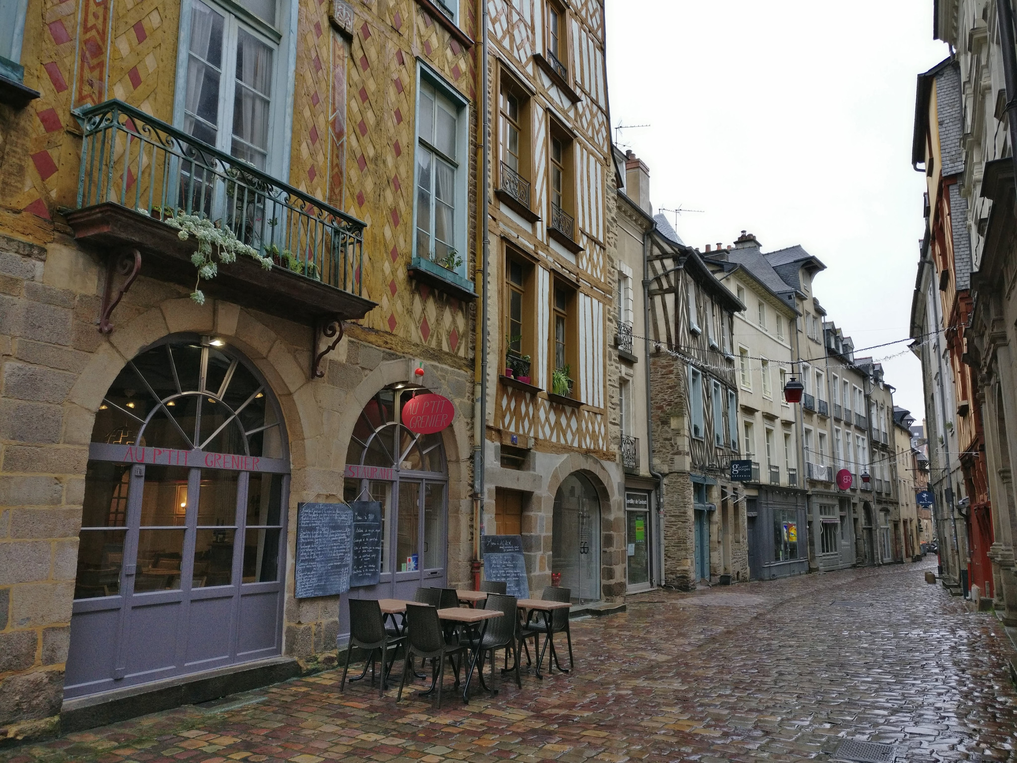 Typical pedestrian street in Rennes, the house on the left is unique because the wood is painted in 3 different colors